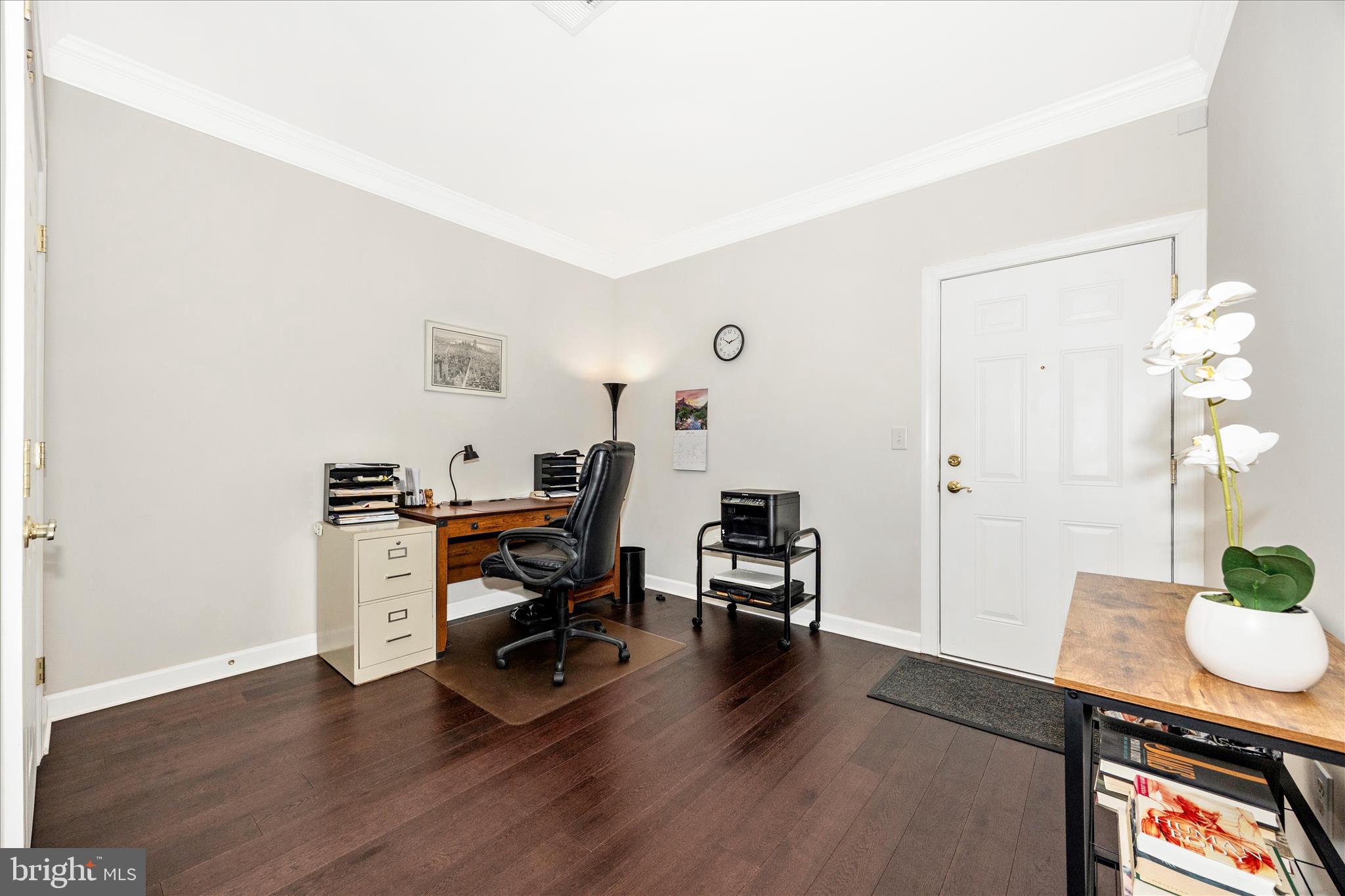35 East All Saints Street, Unit 211 Frederick, MD 21701 - Photo 10 of 61 a view of a workspace with furniture and wooden floor