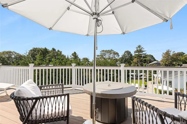 a view of a balcony with wooden floor