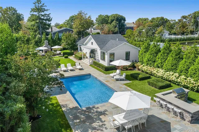 a view of house with garden space and trees