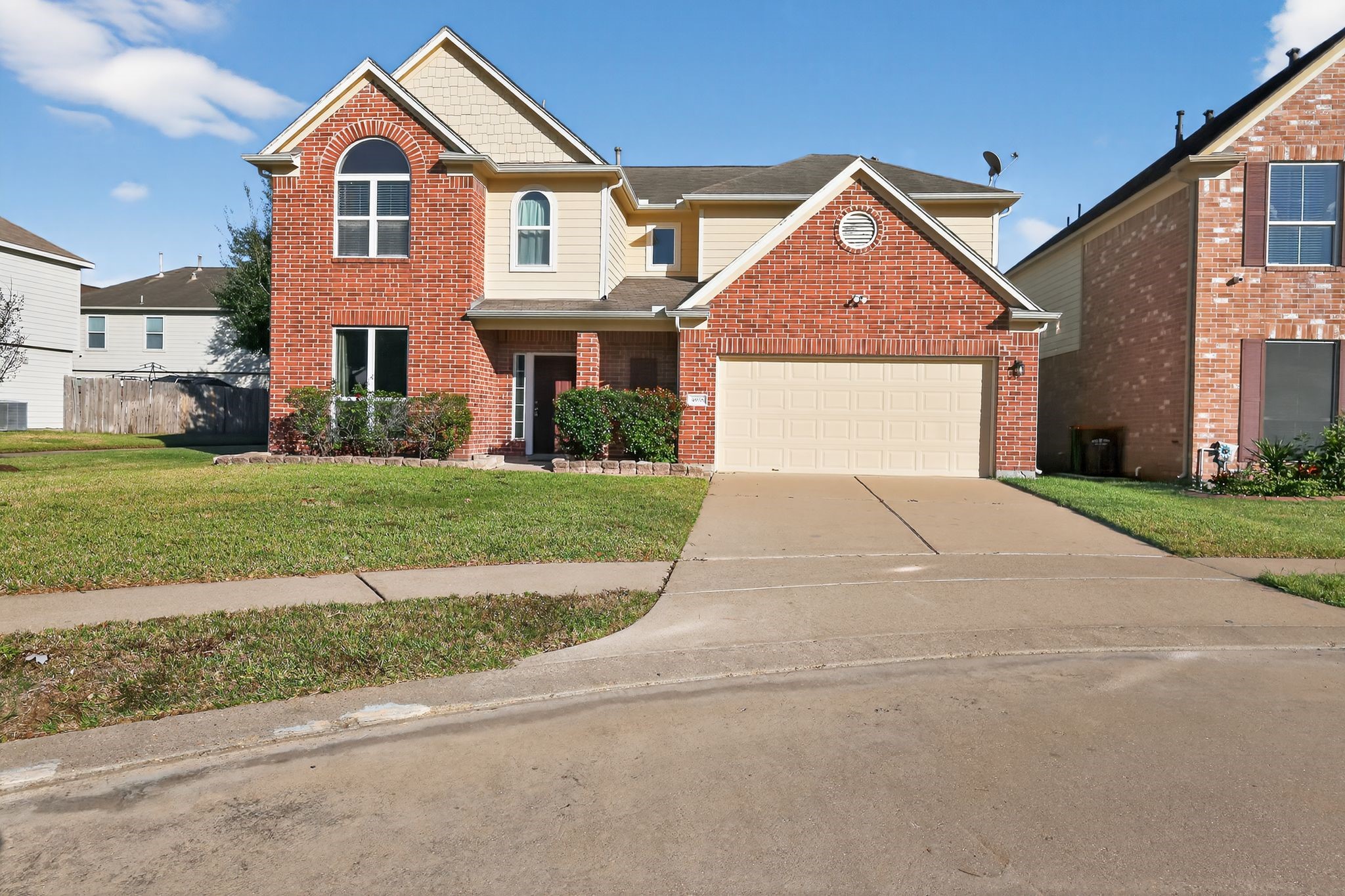 4938 Yearling Ridge Court Katy, TX 77449 - Photo 2 of 29 a front view of a house with a yard and garage