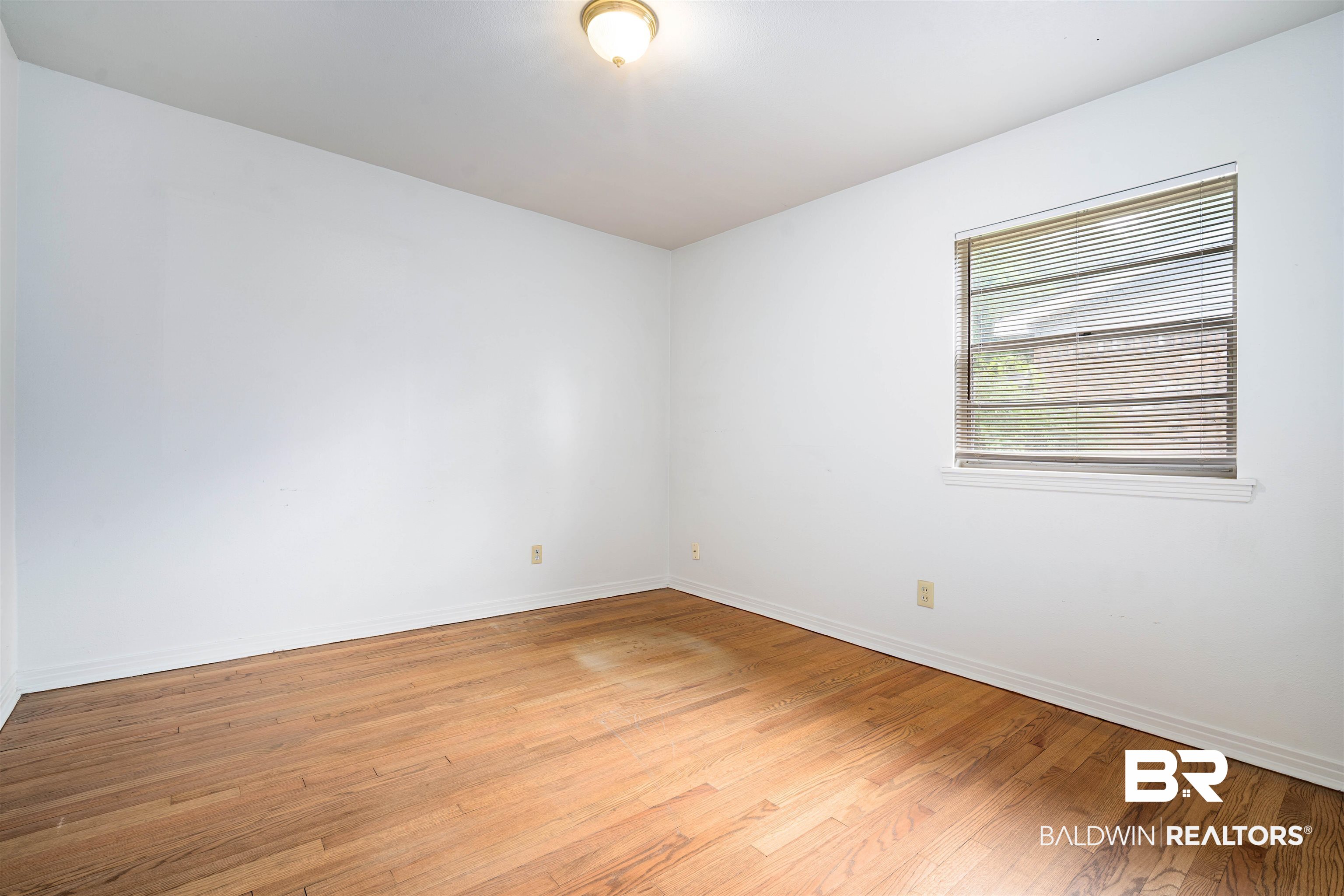 570 Markham Drive Mobile, AL 36609 - Photo 17 of 25 Spare room with baseboards and light wood-style flooring