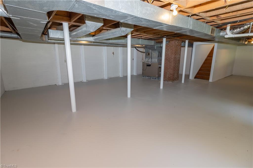 2216 Lane Road Greensboro, NC 27408 - Photo 23 of 38 BASEMENT: YOU HVAC IS IN THE BACK LEFT. PLUS THERE IS A SHELTER SPAC BEHIND THE HVAC.