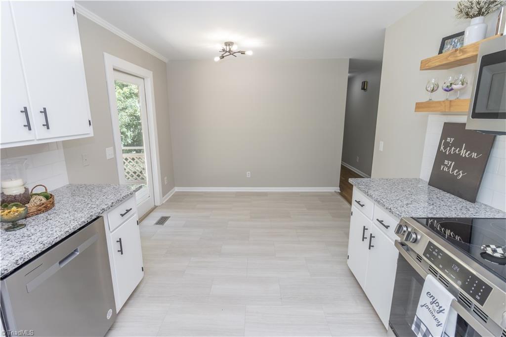 2216 Lane Road Greensboro, NC 27408 - Photo 3 of 38 DINING AREA... GREAT AREA FOR THE DINING ROOM TABLE.
