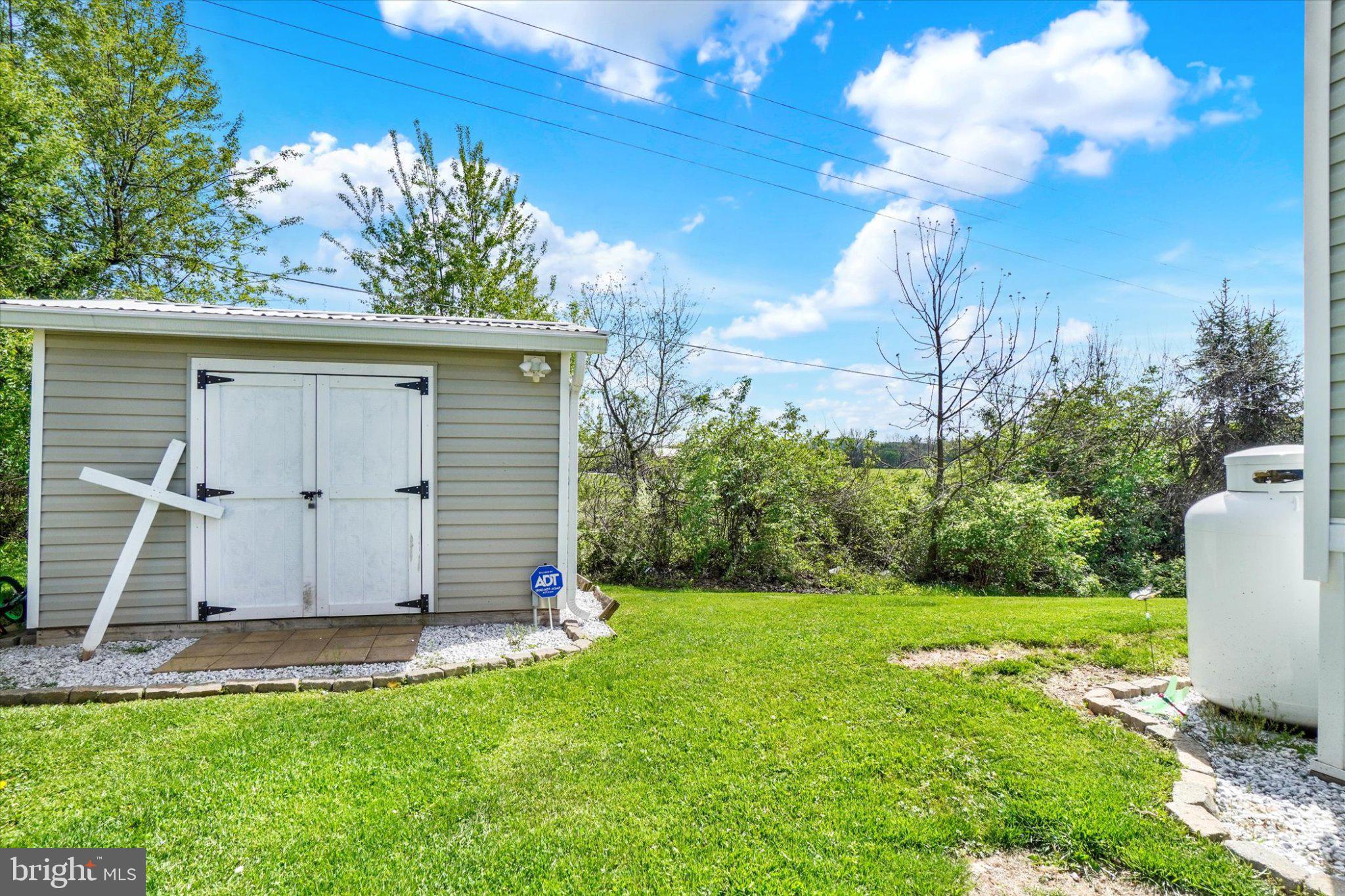 284 B Street York, PA 17408 - Photo 7 of 25 Charming shed amidst lush greenery.