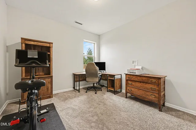 a large kitchen with stainless steel appliances granite countertop plenty wooden cabinets counter space a sink and a center island