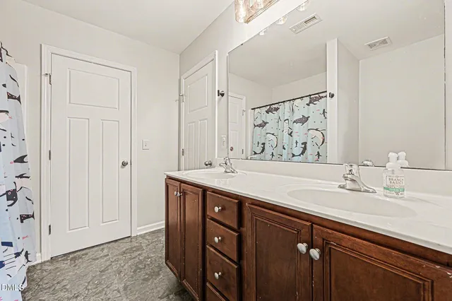 a room with furniture a flat screen tv and gym equipment