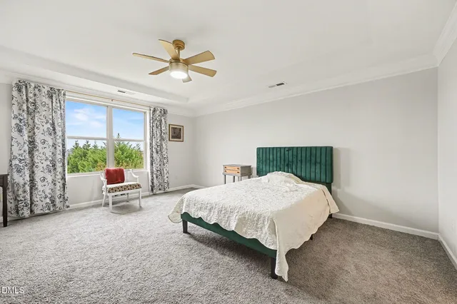 a room with two beds and a window