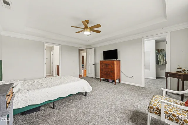 a spacious bathroom with a double vanity sink and a mirror