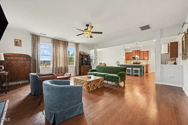 a view of room with furniture and wooden floor