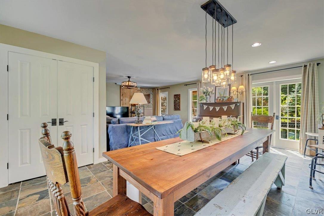 159 Monomonock Road Cresco, PA 18326 - Photo 14 of 50 a room with chandelier fan and wooden furniture