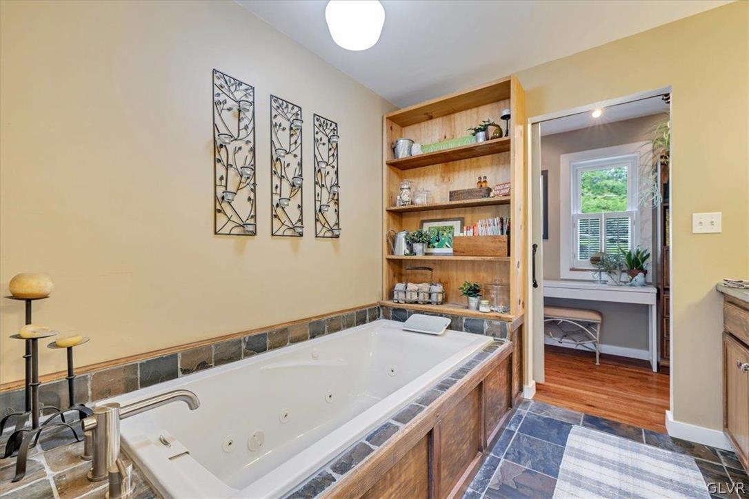 159 Monomonock Road Cresco, PA 18326 - Photo 22 of 50 a bathroom with a tub and a window