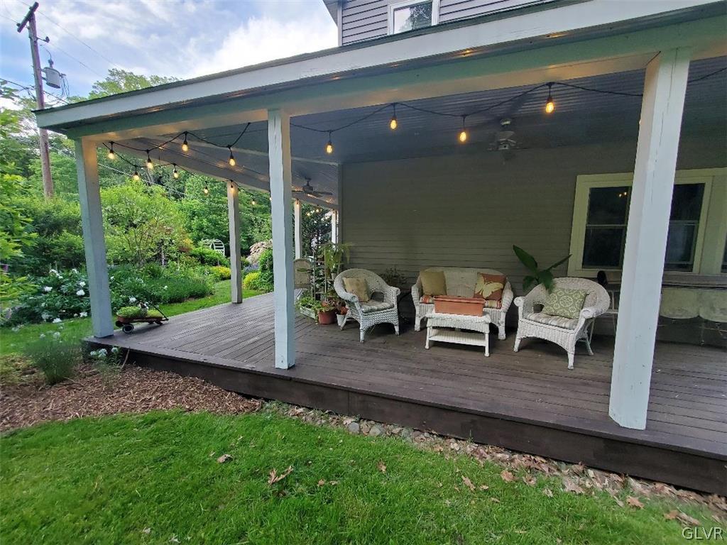 159 Monomonock Road Cresco, PA 18326 - Photo 31 of 50 a living room with patio furniture and a garden
