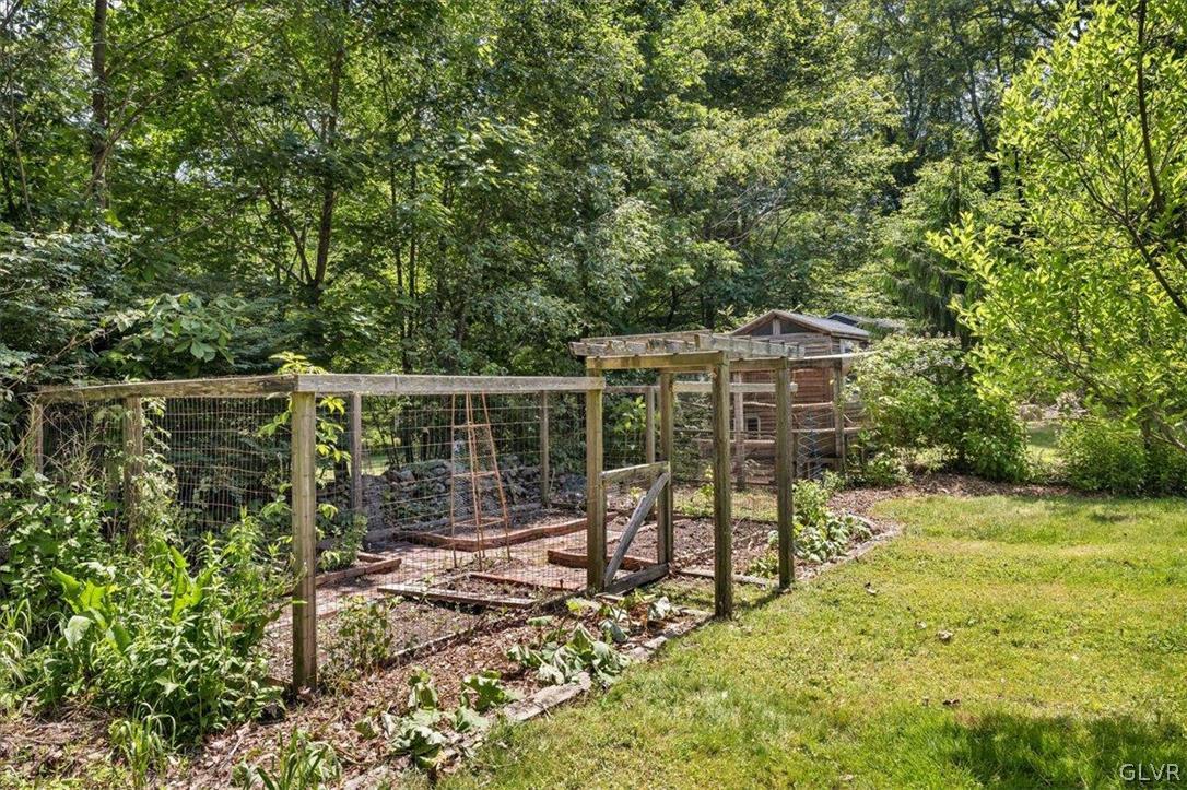 159 Monomonock Road Cresco, PA 18326 - Photo 39 of 50 a view of a bench in the garden