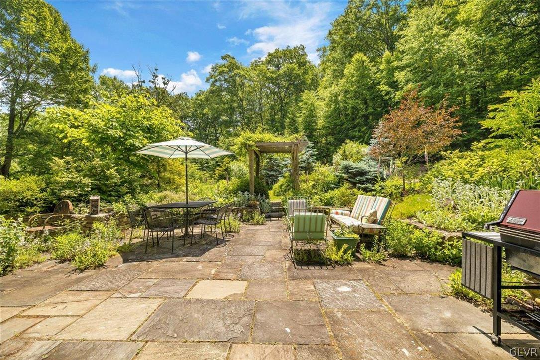159 Monomonock Road Cresco, PA 18326 - Photo 41 of 50 a view of a patio with table and chairs and potted plants