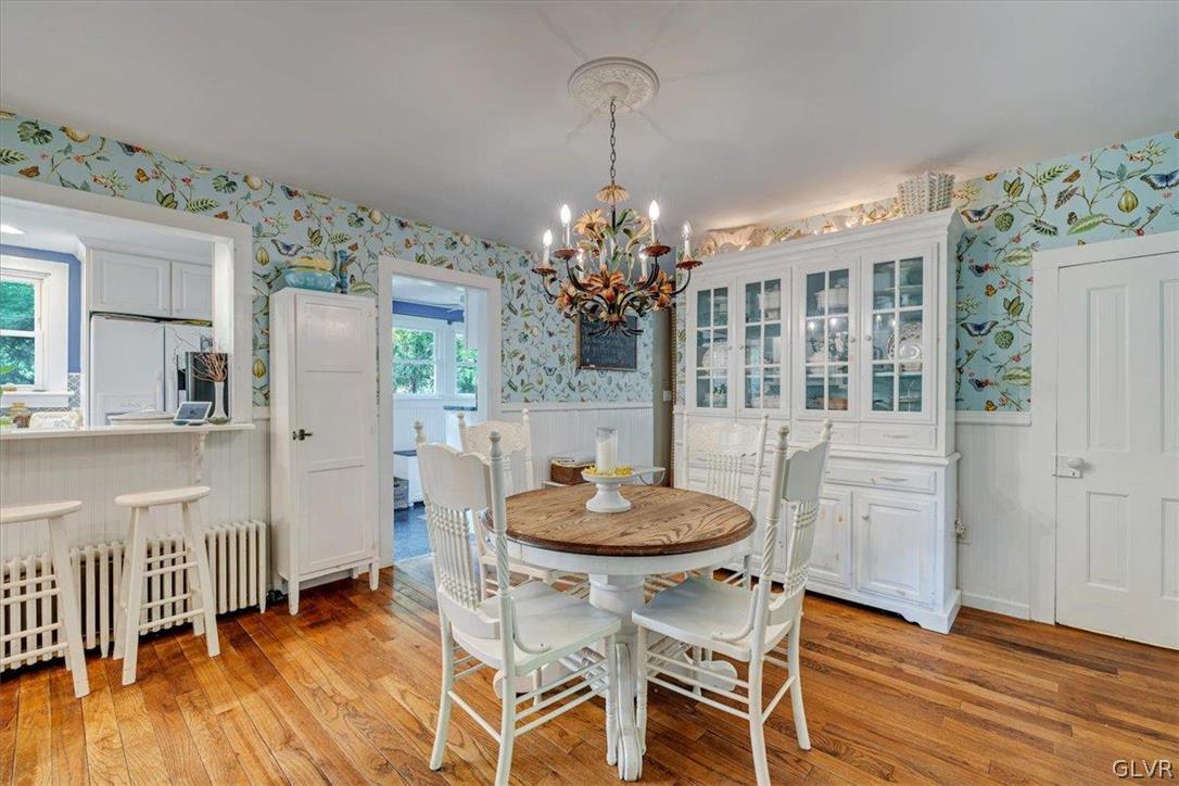 159 Monomonock Road Cresco, PA 18326 - Photo 6 of 50 a dining room with furniture a chandelier and wooden floor