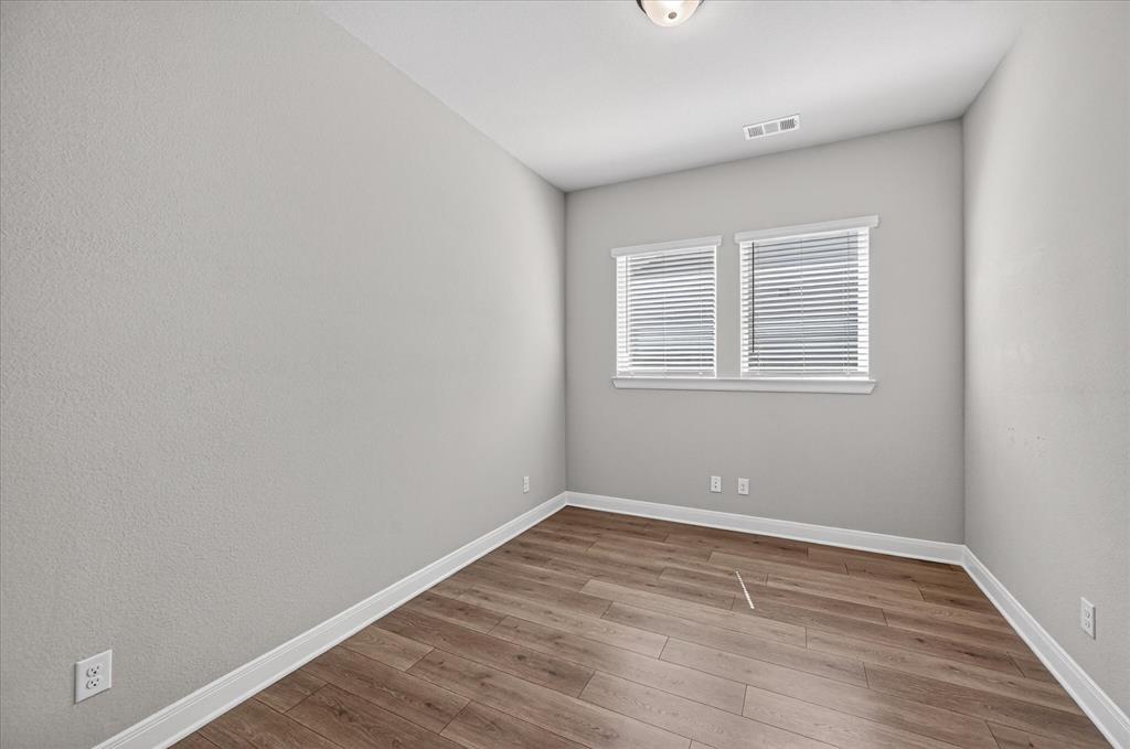 2237 Pika Road Northlake, TX 76247 - Photo 31 of 37 Neutral wall tones complemented by wood-finish flooring