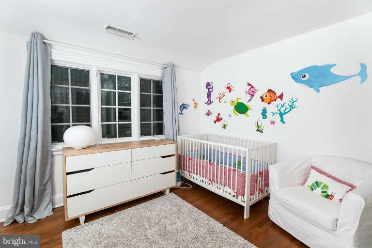 1107 Harriton Road Baltimore, MD 21210 - Photo 20 of 30 a bedroom with furniture and a window