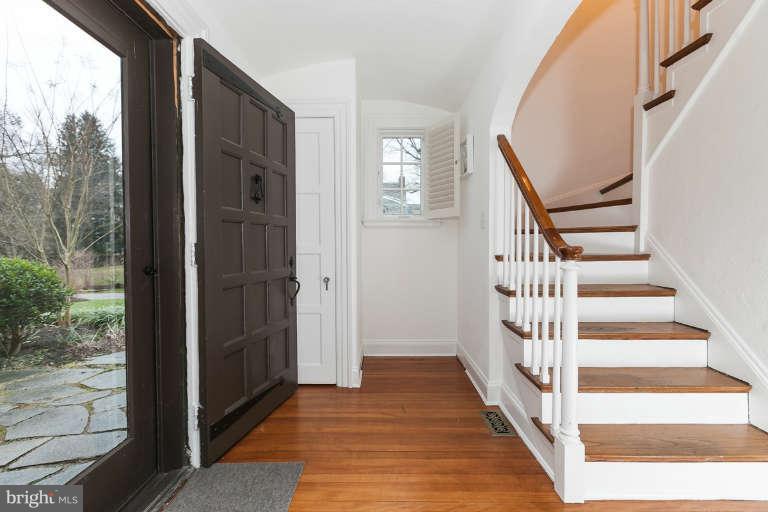 1107 Harriton Road Baltimore, MD 21210 - Photo 8 of 30 a view of a hallway with wooden floor and windows