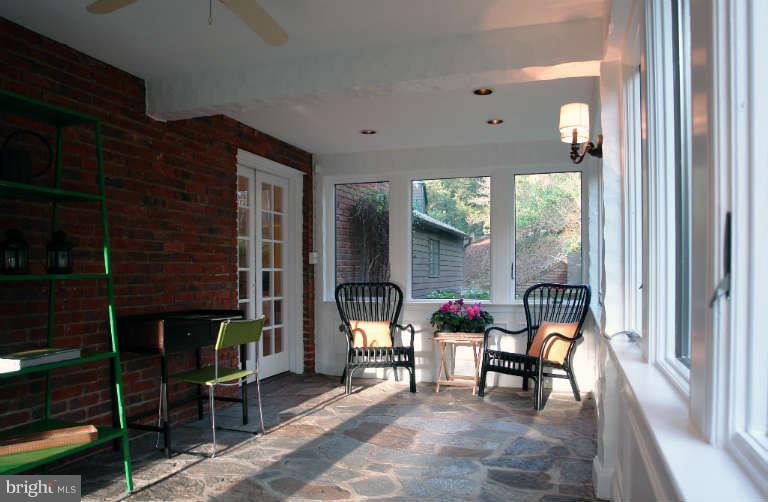 1107 Harriton Road Baltimore, MD 21210 - Photo 10 of 30 a dining room with furniture and a window