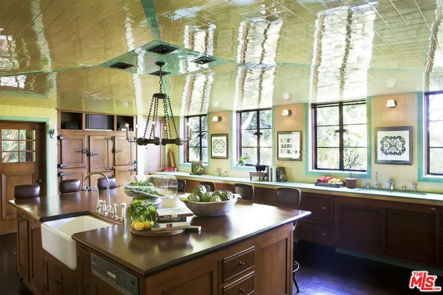 a kitchen with a sink cabinets and window