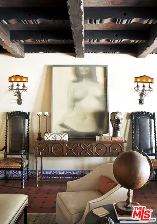 a kitchen with a table chairs and a stove