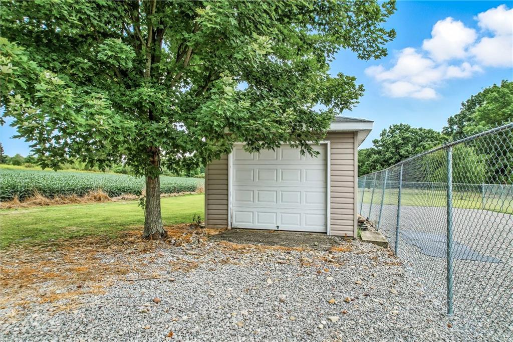 558 Clay Furnace Road Sharpsville, PA 16150 - Photo 13 of 49 a backyard of a house with plants and large tree