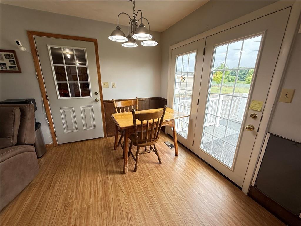 558 Clay Furnace Road Sharpsville, PA 16150 - Photo 25 of 49 a view of a dining room with furniture and wooden floor