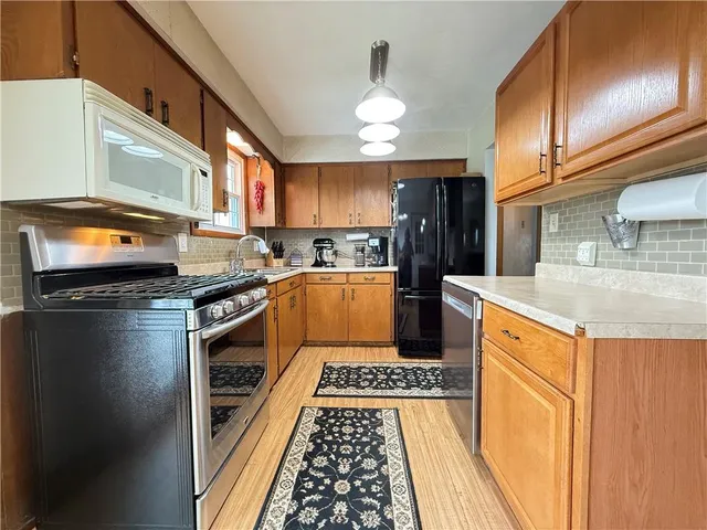 a kitchen with a stove and a sink