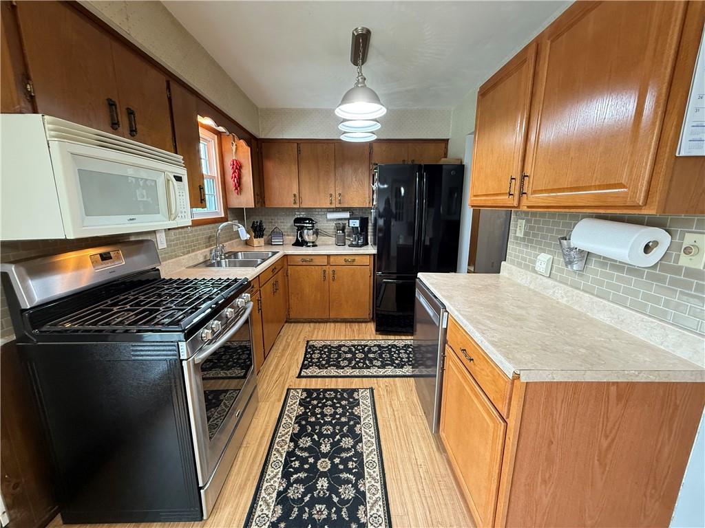 558 Clay Furnace Road Sharpsville, PA 16150 - Photo 27 of 49 a kitchen with a stove and a sink
