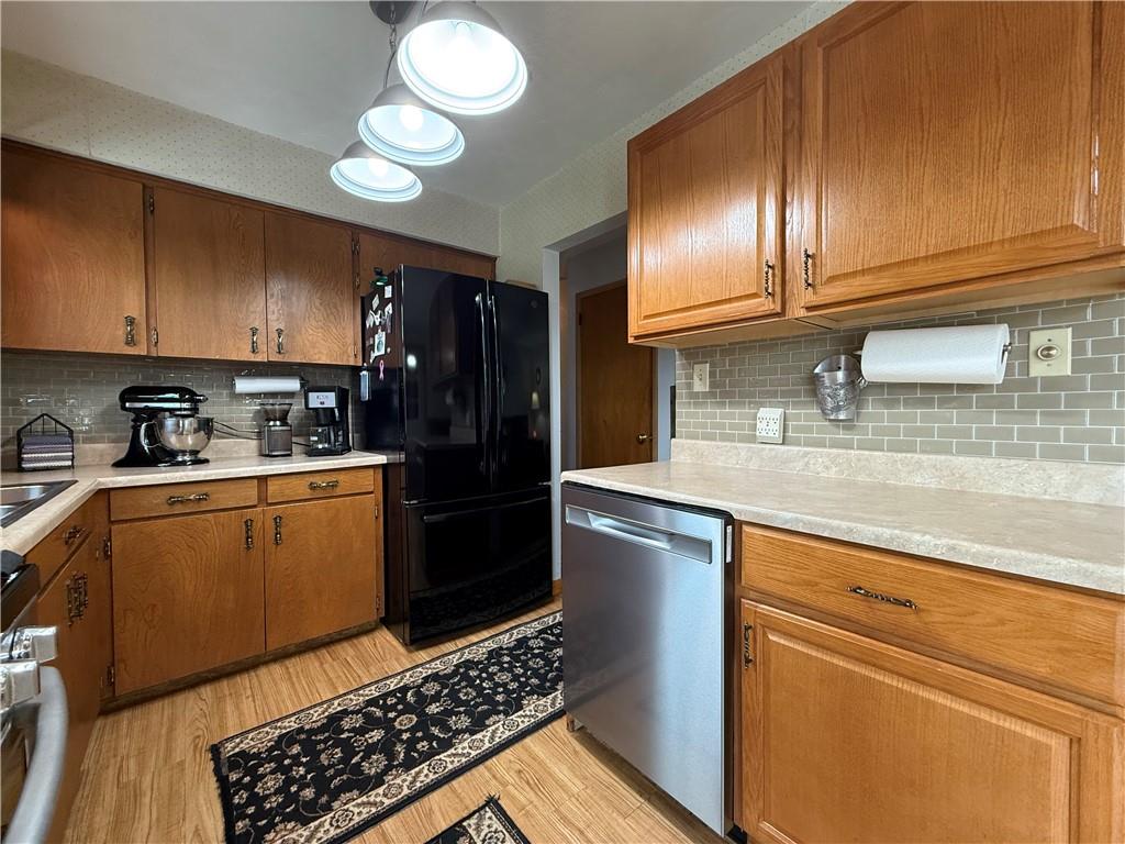 558 Clay Furnace Road Sharpsville, PA 16150 - Photo 36 of 49 a kitchen with granite countertop stainless steel appliances and wooden cabinets