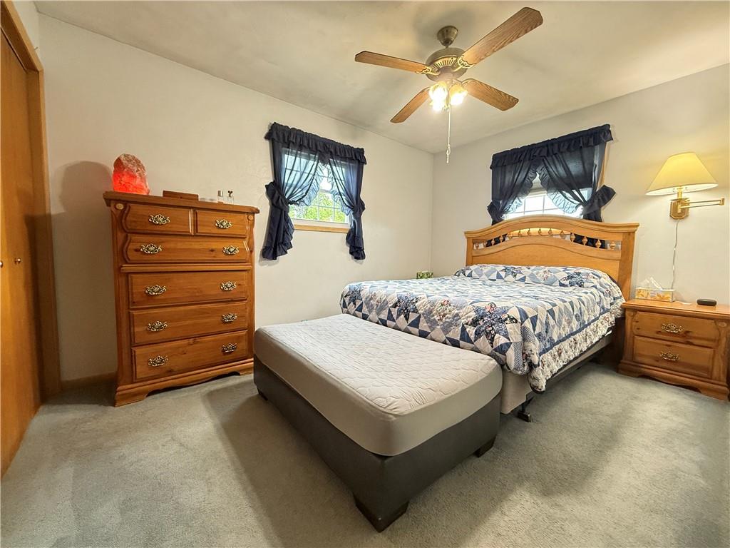 558 Clay Furnace Road Sharpsville, PA 16150 - Photo 38 of 49 a bedroom with a bed and a chandelier