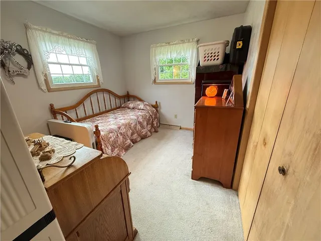 a white toilet sitting next to a bathroom sink