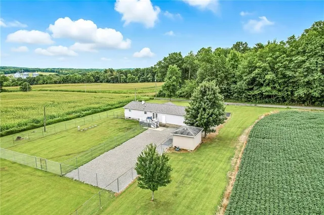 a view of a pool with a yard