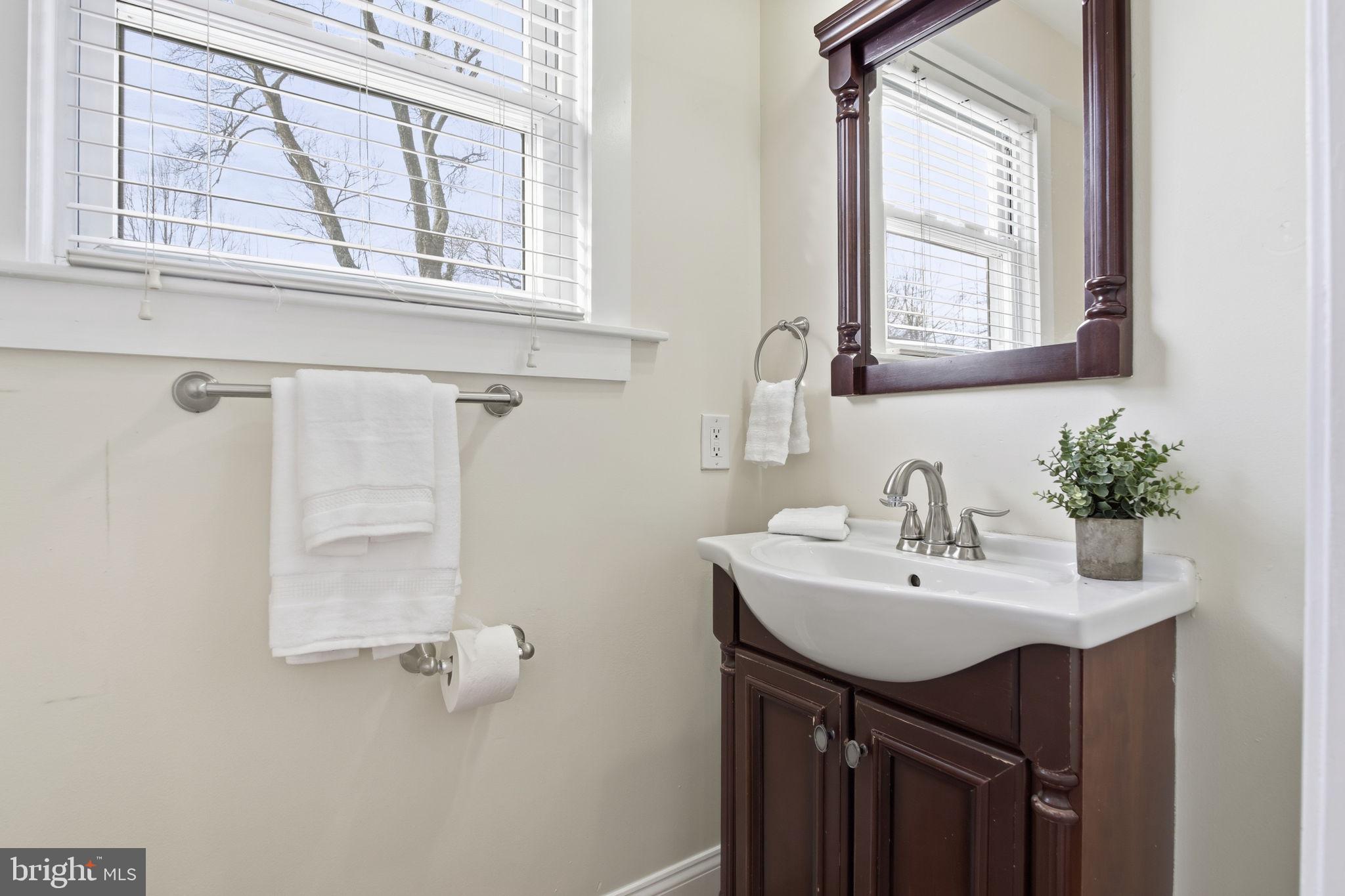2803 Berwick Avenue Baltimore, MD 21234 - Photo 11 of 25 a bathroom with a sink and a mirror