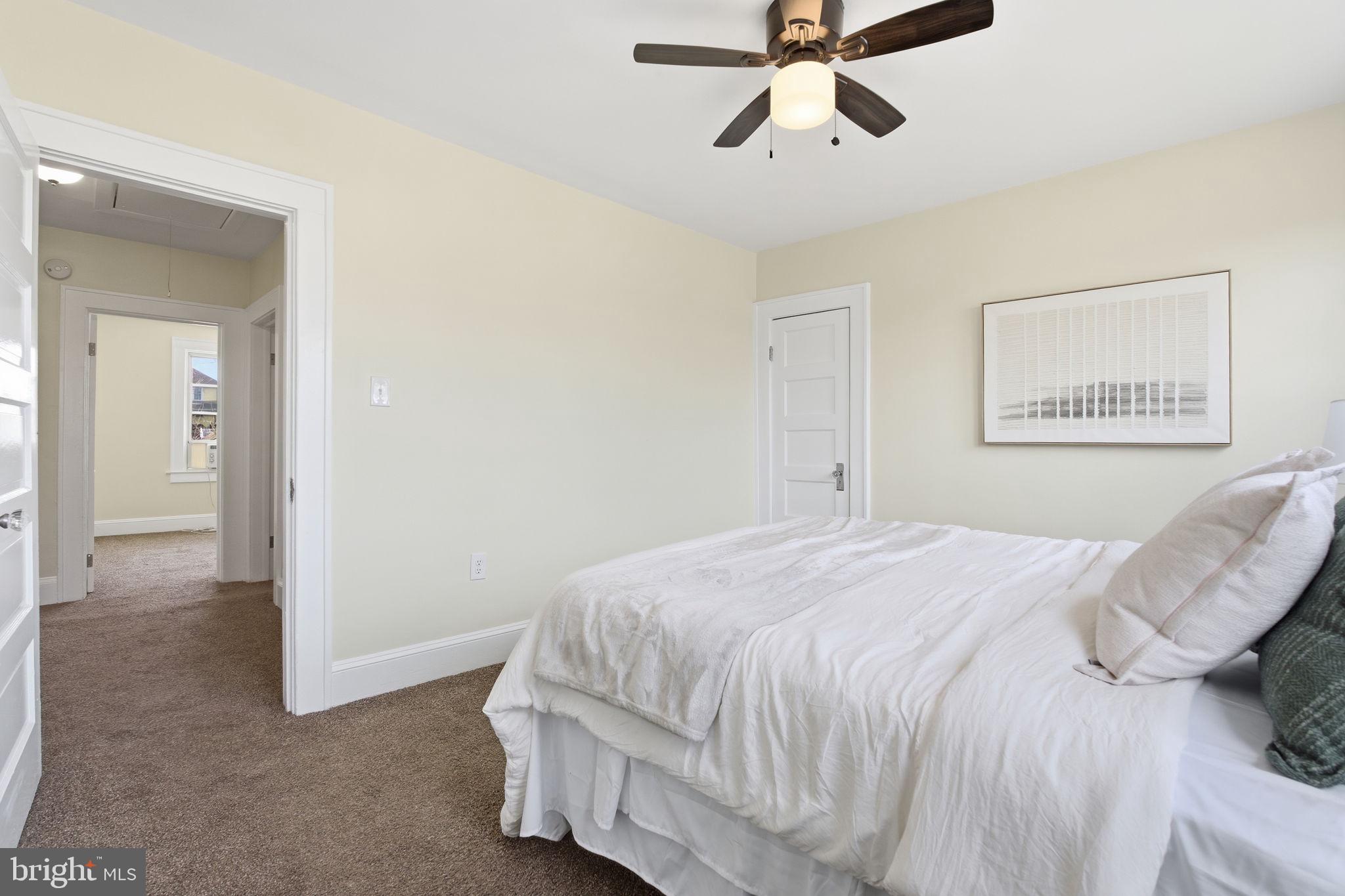 2803 Berwick Avenue Baltimore, MD 21234 - Photo 17 of 25 a bedroom with a bed and cabinets