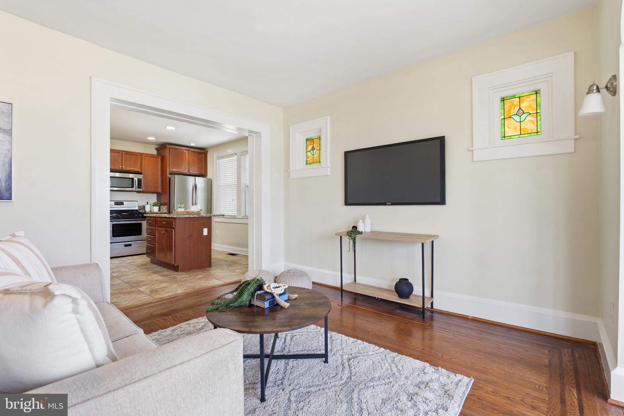 2803 Berwick Avenue Baltimore, MD 21234 - Photo 2 of 25 a living room with furniture and a flat screen tv
