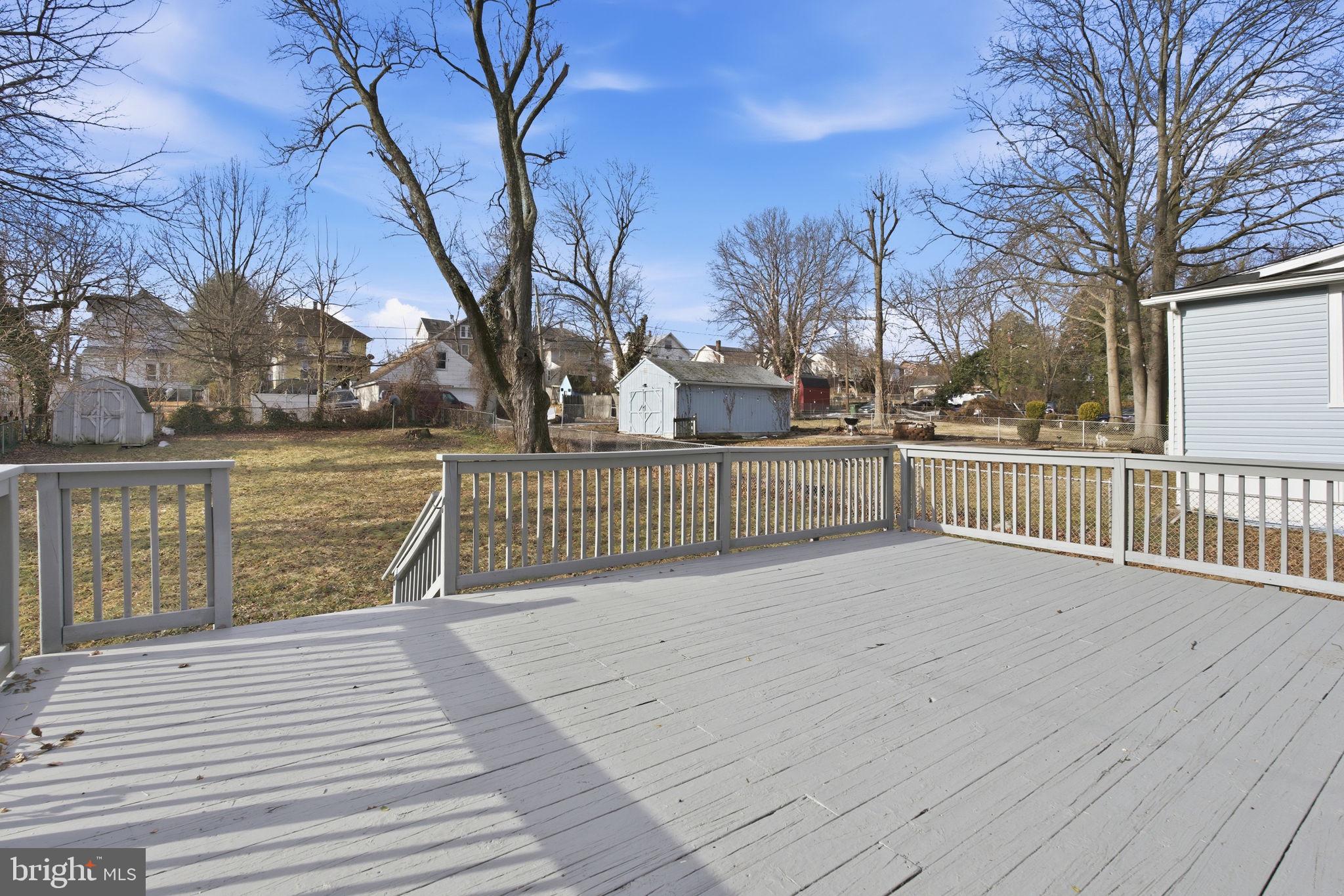 2803 Berwick Avenue Baltimore, MD 21234 - Photo 22 of 25 a deck view with wooden floor and fence next to a yard