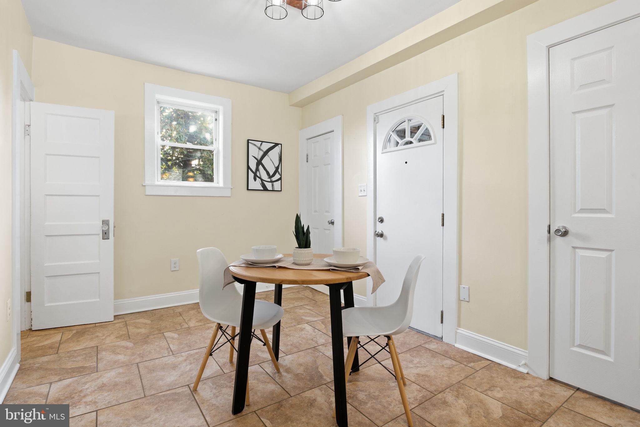 2803 Berwick Avenue Baltimore, MD 21234 - Photo 9 of 25 a view of a room that has a table and chair in it