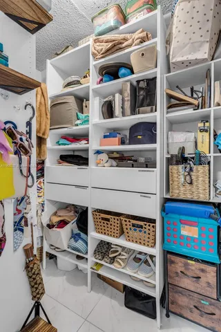 a utility room with stainless steel appliances and cabinets
