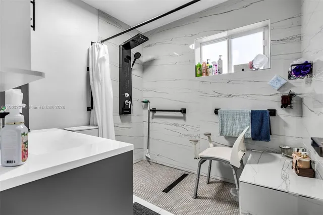 a bathroom with a sink and mirror