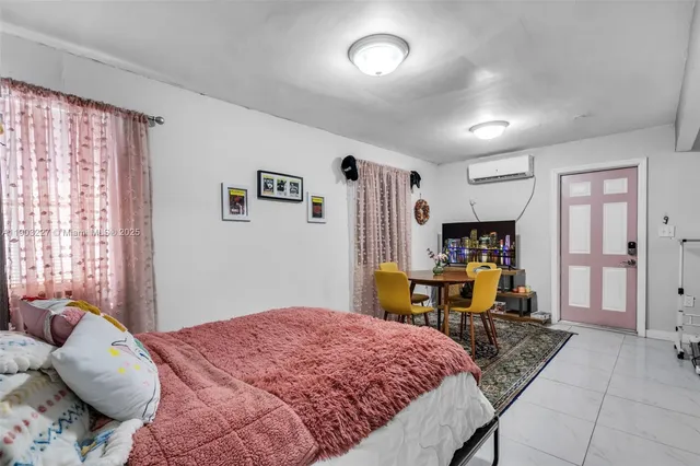 a bedroom with a bed and a desk