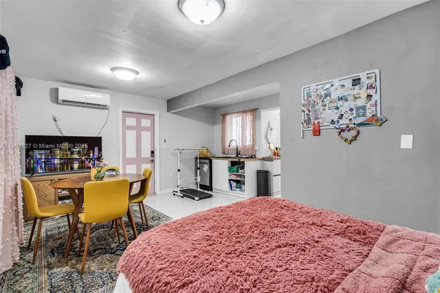 a bed room with a bed and a chair