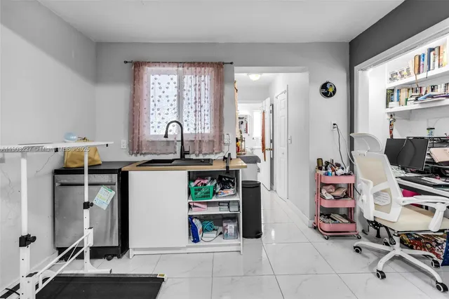 a view of room with workspace and toys