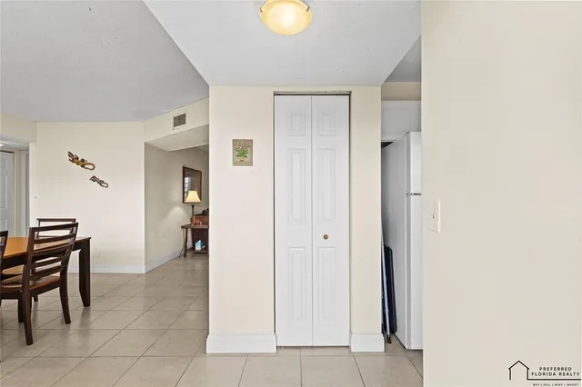 a view of kitchen with furniture and cabinets