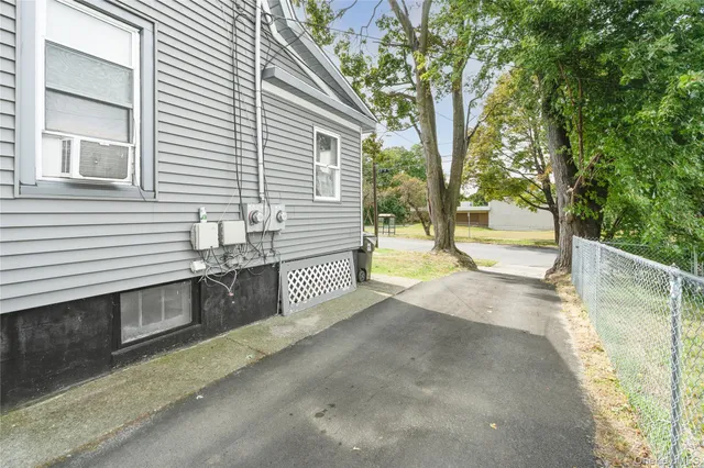 a view of a outdoor space with a house and a bath tub