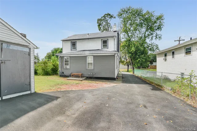 a view of a parking space with a garage