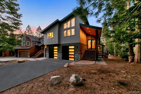 a view of a house with a snow in a yard