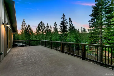 a view of a balcony with trees