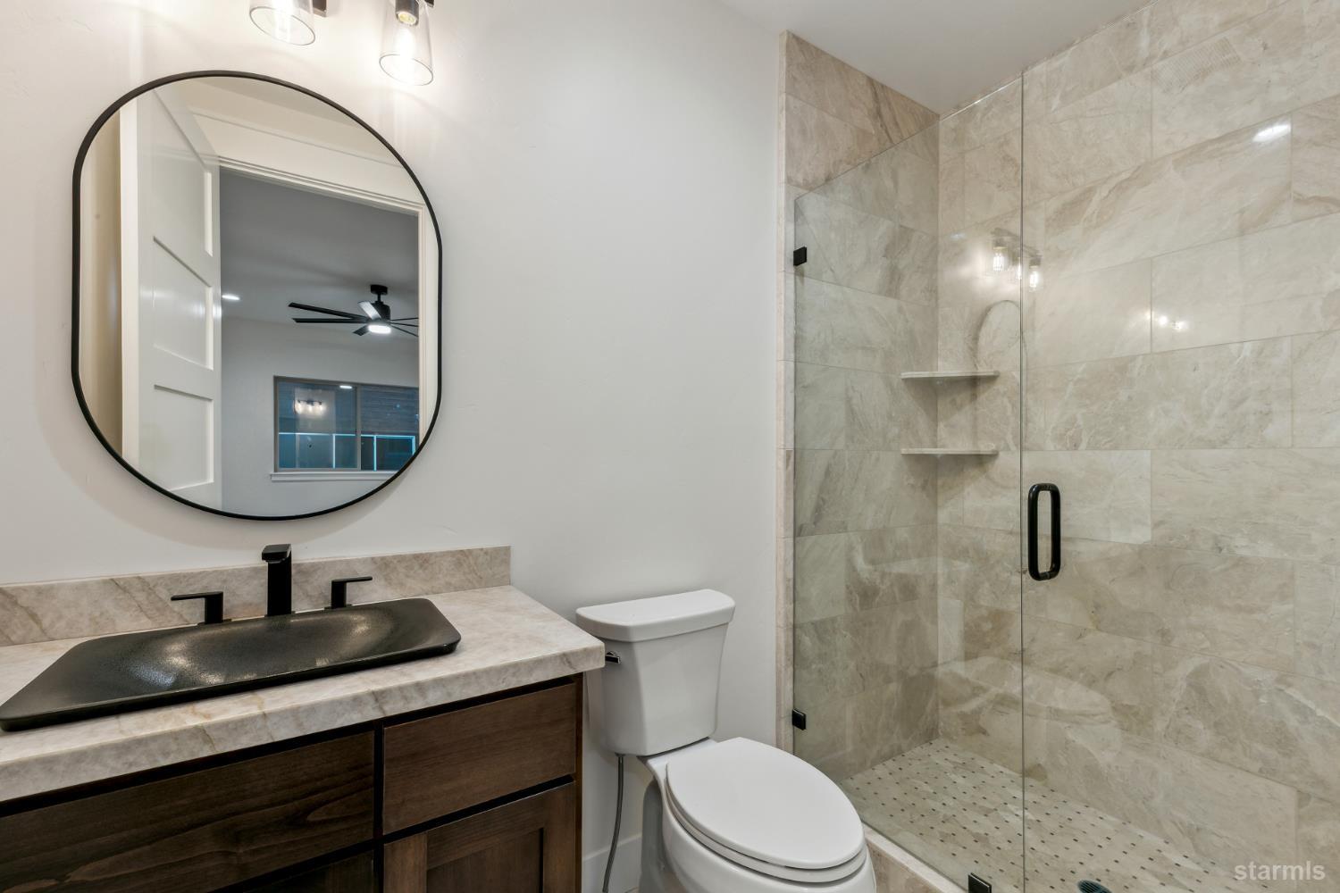 2051 Nez Perce Drive South Lake Tahoe, CA 96150 - Photo 38 of 40 a bathroom with a sink a toilet and a mirror