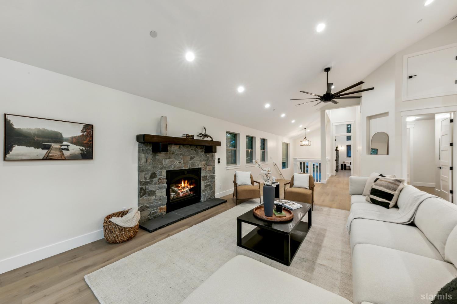 2051 Nez Perce Drive South Lake Tahoe, CA 96150 - Photo 9 of 40 a living room with furniture and a fireplace